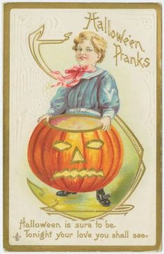 an old fashioned halloween card with a young boy in a pumpkin costume on top of a barrel