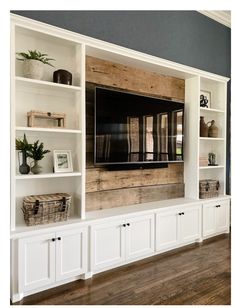 an entertainment center with built in bookshelves and shelves