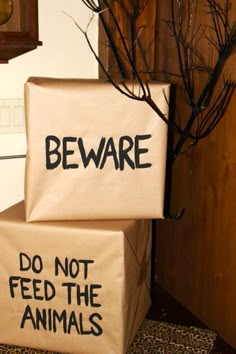 two boxes that say beware and do not feed the animals