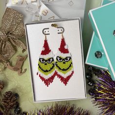 Grinch earrings, adorned with joyful Christmas spirit! These festive beaded earrings add a merry touch to your holiday ensemble. Made with Japanese seed beads, these delightful fringe earrings are a fun and charming accessory for the festive season or a thoughtful gift for someone special 🎁 arriving gift ready in a box  📏 Size Length: 4" (including ear wire) Width: 1 1/4" Made with Japanese seed beads Fun earrings for Christmas 🎄  Select closure  leverbacks earwires  clip-ons for non pierced ears Shop Now! 👉 LUBARO.etsy.com Any questions? Message me! 💬 Happy shopping! 🌟 Grinch Earrings, Xmas Gifts For Her, Earrings Christmas, Christmas Earrings, Fringe Earrings, Fun Earrings, Pierced Ears, Festive Season, Ear Wire