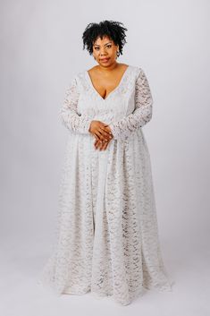 The Rue Gown is perfect for the boho bride. This gown features: V neckline and back made from soft boho-inspired lace, lined with matte satin with supportive boning Flowy, gathered skirt made from soft boho-inspired lace, lined with a matte satin a-line circle skirt Optional fitted sleeves or bishop sleeves with elastic cuffs, available as detachable or permanently attached sleeves Optional small train Center back zipper closure or optional corset back Customize this dress to make it yours by ch Fitted Lace Maxi Dress With Lace Back, V-neck Delicate Lace Maxi Dress For Wedding, Lace Gown With Fitted Bodice And V-neck, Floor-length Lace Wedding Dress With Lace Bodice, Lace Bridesmaid Dress With V-neck, Lace V-neck Bridesmaid Wedding Dress, Lace Bridesmaid Wedding Dress With V-neck, Delicate Lace Maxi Length Wedding Gown, Lace Maxi Dress With Lace Back For Wedding