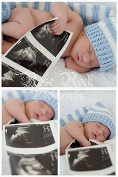 an image of a baby in a blue knitted hat laying on top of a book