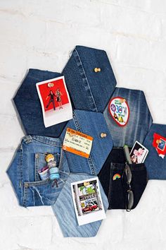 several pairs of jeans are arranged in a hexagonal pattern with photos and magnets on them