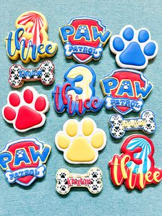 dog themed cookies are displayed on a blue surface