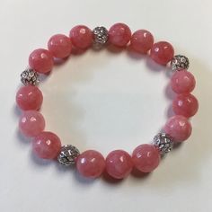 Beautiful 10mm Cherry Quartz Beads With Silver Plated Filigree Beads, Strung On Stretch Cord. Handmade Cherry Colored Round Bead Jewelry, Cherry Quartz, Adjustable Pink Rose Quartz Stretch Bracelet, Cherry Quartz Bracelet, Pink Amethyst Round Beads Bracelet, Pink Rose Quartz Jewelry With 8mm Beads, Silver Filigree, Stretch Bracelets, Womens Jewelry Bracelets