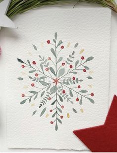 a card with an image of a snowflake surrounded by christmas decorations and other items