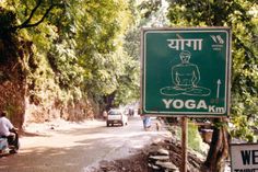 there is a sign on the side of the road that says yoga in human language