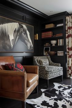 a living room with two chairs and a horse painting on the wall above it's bookshelf