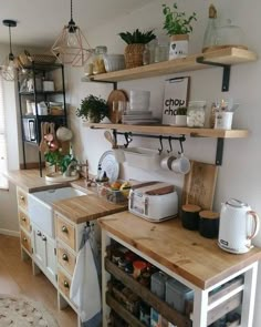 a kitchen with open shelving and wooden counters