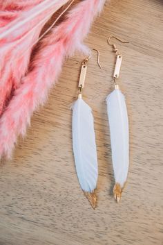 White and Gold Feather earrings Each feather is carefully selected and paired together to make these delicately beautiful earrings. All earwires are Nickle-free. These flirty earrings are the perfect accessory for your next girl's night outfit!  They are a must have addition to your accessory collection! These are in stock and ready to ship.  These earrings are approximately 5" in length Each earring set is handmade and unique- no two are the same! White Feather Dangle Earrings, Elegant White Feather Earrings, Gold Feather Earrings As A Gift, Gold Feather Earrings For Gift, Adjustable White Feather Jewelry, Adjustable Gold Feather Earrings, Gold Feather Earrings, Girls Night Outfit, Earrings Feather