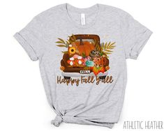 "Are you ready for the Autumn Season? Show off your love for fall in this Happy Fall Y'all T Shirt designed for every fall lover. It is the perfect fall gift for your friend or loved one. Growing up in the country, I had to feature a truck pulling pumpkins and wheat! It is perfect to wear to Halloween Party or Thanksgiving Dinner! Not interested in this design? I have several other Fall Shirts listed below! More Fall Shirts & Fall Mugs Here: https://www.etsy.com/shop/thatbamfam?section_id=33794364 MULTIPLE COLOR OPTIONS OFFERED! PRODUCT DETAILS & SIZING + 100% combed ring spun cotton Bella Canvas shirts + Light fabric + Tear away label + Size chart can be found on listing photos + Unisex fit, runs true to size + Pre-shrunk Fabric SHIPPING AND PRODUCTION TIME - Production time is 3-5 busine Graphic Print Tops For Birthday In Fall, Fall Crew Neck Birthday T-shirt, Crew Neck Birthday T-shirt For Fall, Cute Fall Birthday Tops, Birthday Gift For Bestie, Fall Graphic Tees, Autumn Shirts, Gift For Bestie, Outfit Birthday