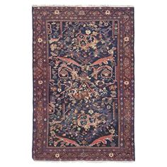 an antique persian rug with blue and red colors