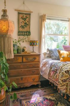 a bed room with a neatly made bed next to a window and a rug on the floor