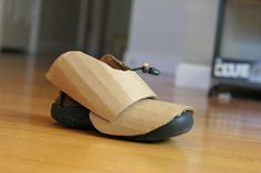 a pair of shoes sitting on top of a wooden floor