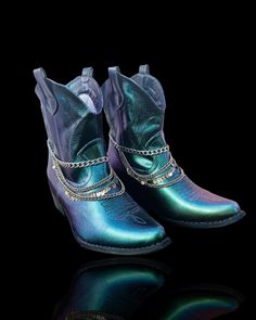 🪩 Custom Disco Cowboy Boots - Hand Painted Chameleon Chrome Color Changing | One-of-a-Kind, Embellished with Silver Chain 🪩 Step into the spotlight with our custom disco cowboy boots, designed to turn heads and steal the show! Each pair is a unique work of art, meticulously hand-painted with a stunning chrome color that changes hues from vibrant blue, to cool green, and a hint of purple. These boots are the perfect blend of retro disco flair and classic cowboy style. 💫Features: Hand Painted: Country Style Moto Boots With Round Toe For Rodeo, Country Style Moto Boots For Western-themed Events, Multicolor Western Boots With Snip Toe, Bohemian Moto Boots With Round Toe For Festival, Bohemian Moto Boots For Festival, Party Western Moto Boots With Snip Toe, Western-style Party Moto Boots With Snip Toe, Western Snip Toe Moto Boots For Party, Western Style Snip Toe Moto Boots For Party