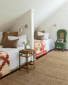 two beds in a room with white walls