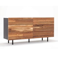 the sideboard is made out of wood and has metal legs on one end, and an open drawer on the other