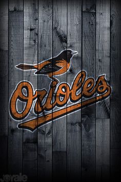 the baltimore orioles logo on a wooden fence poster by joe schrecker - prints