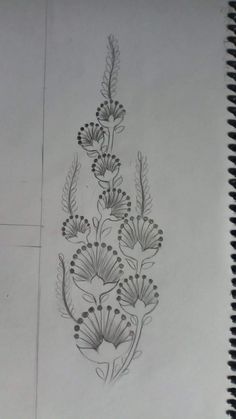 a drawing of flowers and leaves on paper