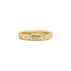 a yellow gold wedding band with an intricate design