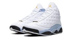 The Air Jordan 13 “Blue Grey” is a colorway of Michael Jordan’s thirteenth signature shoe with a versatile look.  Yet another clean take on the Jordan 13, the “Blue Grey” features white dimpled leather panels on the side, smooth white leather on the toe, and Blue Grey suede on the heel, mudguard, and midsole.  The Jordan 13’s signature holographic emblem appears on the collar.  A Yellow Ochre Jumpman is embroidered on the white leather tongue.  A black “Jordan” branded tab appears on the vamp. Black Tongue, Nike X Travis Scott, Grey Jordans, Black Jordans, Jordan Shoes Retro, Shoes Retro, Jordans Women, Yellow Ochre, Jordan 2