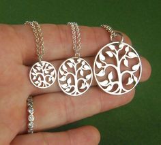 Tree of life necklace in sterling silver, family tree, silver tree charm, sterling silver tree necklace, heirloom jewelry, nature, mother's day A sterling silver tree of life charm is suspended from a sterling silver chain that can be up to 22 inches in length. It is secured with a sterling silver spring clasp. You can choose from a small tree charm that measures 15mm (0.59 inches) in diameter, a medium tree that measures 20mm (0.79 inches) in diameter, or a large tree that measures 30mm (1.18 i Personalized Sterling Silver Nature-inspired Necklaces, Personalized Nature-inspired Sterling Silver Necklaces, Nature-inspired Sterling Silver Jewelry For Mom, Silver Tree Of Life Jewelry For Mother's Day, Mother's Day Silver Tree Of Life Jewelry, Sterling Silver Tree Of Life Nature-inspired Jewelry, Sterling Silver Tree Of Life Jewelry For Anniversary, Sterling Silver Tree Of Life Jewelry Gift For Mom, Silver Jewelry With Tree Of Life For Mom