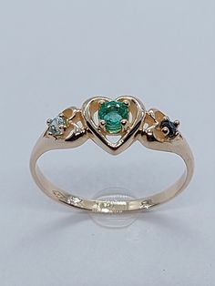 This stunning Emerald , Aquamarine and Sapphire Ring has been carefully crafted in warm 14k Yellow Gold, authentic Emerald and White Diamonds. This ring will make an unforgettable anniversary/birthday/special occasion gift! If you love emeralds you have found the perfect ring. "Emerald is a Seeker of Love and a Revealed of Truth, inspiring an ongoing search for meaning, justice, compassion and harmony." All of my jeweler is handmade from scratch and of high quality. Ring can be resized at no ext 14k Gold Multi-stone Emerald Ring Gift, 14k Gold Multi-stone Emerald Ring As A Gift, Heirloom Style 14k Gold Emerald Ring For Anniversary, Stamped 14k Gold May Birthstone Ring, Emerald Multi-stone Birthstone Ring For Anniversary, 14k Gold Anniversary Birthstone Ring, Heirloom Sapphire Ring For Anniversary, May Birthstone, Green Sapphire Ring In 14k Gold For Anniversary, Hallmarked 14k Gold Emerald Ring For Anniversary