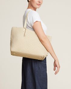 Handwoven neoprene with vegan leather handles in cream. The Jetsetter Small Tote can be carried for travel, work, or baby. Cream Woven Leather Bag, Neutral Shoulder Bag With Rolled Handles For Travel, Beige Woven Bags For On-the-go, Neutral Woven Leather Bag For Everyday Use, Everyday Neutral Woven Leather Bags, Beige Woven Leather Bag For On-the-go, Cream Woven Leather Bag For Daily Use, Everyday Cream Woven Leather Shoulder Bag, Cream Woven Leather Shoulder Bag For Daily Use