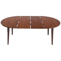 an oval wooden table with four legs