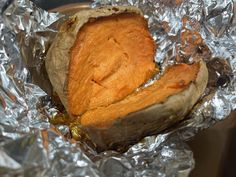 a baked sweet potato sitting on tin foil