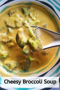 broccoli and cheese soup in a bowl with a spoon