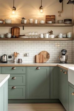 ❤️ Save for later 👉 Tap to see all 61+ Taupe Kitchen Cabinets | Seeking a nature-inspired palette? This sage green and taupe kitchen design brings organic harmony home. Pin this sage green combination to create a fresh cooking space. Kitchen Cabinet Sage Green, Green Cubords Kitchen, Bottom Kitchen Cabinets Different Color, Muted Green Kitchen Cabinets, Green And Taupe Kitchen, Green Grey Kitchen Cabinets, Sage Green Kitchen Cabinets Farmhouse, Grey Green Kitchen Cabinets, Green Small Kitchen