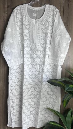 Soft cotton classic white hand embroidered Kurta. Length:47 inches   Matching Cotton Liner Included Embroidery designs may vary Classic White Traditional Wear For Festive Season, Classic White Kurta For Festive Occasions, White Embroidered Cotton Traditional Wear, White Traditional Wear With Chikankari Embroidery For Eid, White Traditional Wear With Floral Embroidery For Eid, Classic White Long Sleeve Kurta, Eid White Traditional Wear With Floral Embroidery, White Embroidered Traditional Wear, White Embroidered Traditional Wear With Long Sleeves