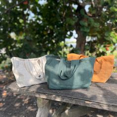 "Dive into the elegance of simplicity with our handcrafted Small Linen Handbag. Perfectly tailored for daily outings, it's a blend of practicality and fashion-forward design. ✅ Primary Color: Deep Blue Green  | Camel Mustard | Natural Beige Features: 🍃 Superior Quality Material: * Made from 100% pure heavyweight linen, guaranteeing lasting durability coupled with a delicate feel. * Weight: 280 g/m² (8.26 oz/yd²) * Inner Lining Weight: 205 g/m² (6.05 oz/yd²) 🍃 Safety Certified: Rest easy knowing our bags are OEKO-TEX® Standard 100 certified. Your assurance that they are both safe and free from harmful chemicals. 🍃 Smart & Stylish Design: * An extra layer of linen lining boosts its robustness. * An internal pocket ensures that your essentials remain within reach. * The softened texture of Eco-friendly Everyday Shoulder Bag, Green Bag With Pockets For Everyday Use, Green Everyday Bag With Pockets, Eco-friendly Tote Shoulder Bag For Everyday, Everyday Eco-friendly Tote Shoulder Bag, Eco-friendly Green Shoulder Bag With Pockets, Eco-friendly Tote Bag For Everyday Use, Eco-friendly Daily Tote Shoulder Bag, Eco-friendly Rectangular Shoulder Bag For Everyday Use