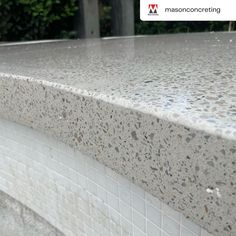 a close up view of the top of a granite countertop with white and gray speckles