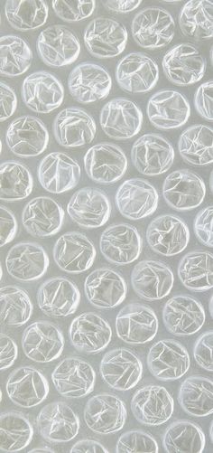 a close up view of the white plastic material that looks like circles on a sheet of paper