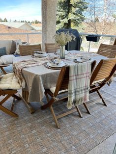 the table is set for two on the porch