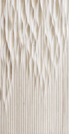 a close up view of a white wall with wavy lines on the outside and inside