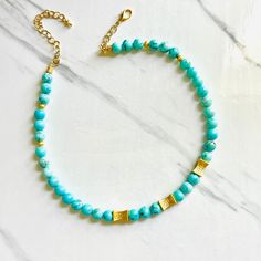 Our Antigua Turquoise Beaded necklace is a breath of fresh air, with brilliant blue hues that are reminiscent of the waters in Antigua. We're now offering in matte gold as well as shiny gold. Etched gold beads offer a striking contrast and we've added some chain so you can adjust the length. Necklace measures 18” in length with lobster clasp closure and is free from cadmium, lead, and nickel. Please note every batch of turquoise varies in color.