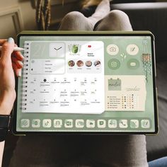 a person is holding up a laptop with a calendar on the screen and other icons