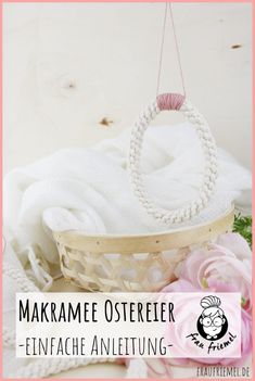 a basket that is sitting on top of a table with flowers in it and the words makramee ostereer - finfache anleig