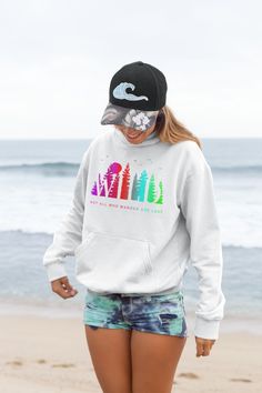 Introducing our Camping Hoodie, a must-have for all adventure enthusiasts! This hoodie features a stunning colorful gradient forest graphic that captures the essence of the great outdoors. With the inspiring saying "WILD-Not All Who Wander Are Lost" boldly printed, it serves as a reminder to embrace your wild spirit and wanderlust. Surfer Hoodie, Oval Logo, Shark Gifts, Shark Lover, City Woman, Flat Collar, Mötley Crüe, Neck Label, Ocean City