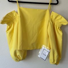 Beautiful Back Top That Has Off The Shoulder Sleeves Solid Off-shoulder Crop Top For Spring, Spring Off-shoulder Solid Crop Top, Off-shoulder Crop Top For Spring, Spring Off-shoulder Crop Top, Chic Cropped Yellow Tops, Chic Yellow Cropped Tops, Yellow Fitted Off-shoulder Tops, Fitted Off-shoulder Yellow Tops, Chic Plain Colored Spring Crop Top