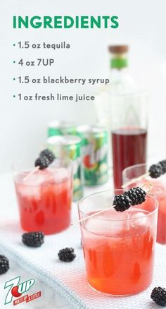 three glasses filled with raspberry punch on top of a white tray next to bottles