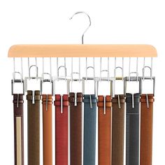 a wooden hanger with leather belts hanging from it's sides and two hooks on each side