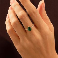 Make a statement of unparalleled beauty with our Pear Cut Emerald Ring. The mesmerizing pear-shaped emerald, with its rich and velvety green color, is the focal point of this exquisite ring. Whether worn as an engagement ring or a striking accessory, the pear cut and sparkling details make it a timeless and unforgettable addition to any jewelry collection. - Decorated with handset white cubic zirconia stone - Pear cut lab-grown emerald- Made in 14k solid gold - Band Width: 1.53 mm \ 0.060 inches 14k Gold Teardrop Jewelry For Promise, Pear-shaped Solitaire Jewelry For Promise, Pear-shaped Solitaire Promise Jewelry, Teardrop 14k Gold Jewelry With Center Stone, Pear-shaped Promise Ring In Fine Jewelry, Pear-shaped Center Stone Promise Ring, Pear-shaped Fine Jewelry For Promise, 14k Gold Teardrop Emerald Ring For Anniversary, Teardrop Emerald Promise Ring In Fine Jewelry Style