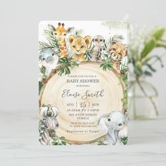 an animal themed first birthday party card with watercolor animals and greenery on it