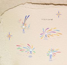 an artistic drawing of fireworks on a piece of paper