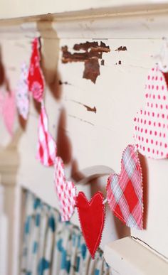 red and white hearts are hanging on the wall