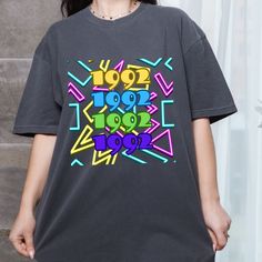 This Retro 90s Tshirt is the perfect addition to your wardrobe! This soft and super comfortable shirt will also make the perfect gift for someone special. Size up for an oversized look!  Sizes S-3xl  Comfort Colors introduces its garment-dyed t-shirt; a fully customizable tee made 100% with ring-spun cotton. The soft-washed, garment-dyed fabric brings extra coziness to your wardrobe while the relaxed fit makes it an excellent daily choice. The double-needle stitching throughout the tee makes it Trendy Retro Print T-shirt For Streetwear, Retro Print Short Sleeve T-shirt For Streetwear, Cheap Oversized 90s T-shirt, 90s Style Printed Multicolor T-shirt, Cheap 90s Inspired Cotton T-shirt, 90s Retro Print T-shirt For Streetwear, 90s Printed Multicolor T-shirt, 90s Tshirt, 90s Retro Print Cotton T-shirt